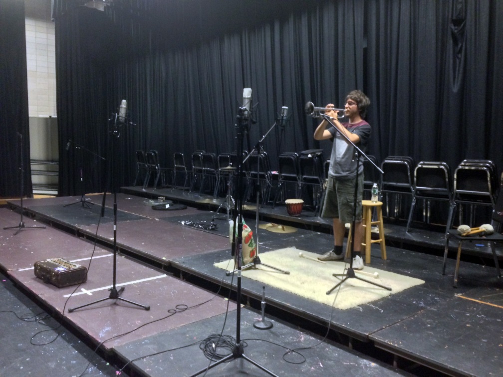 Sam Hebert playing trumpet during the sampling session.